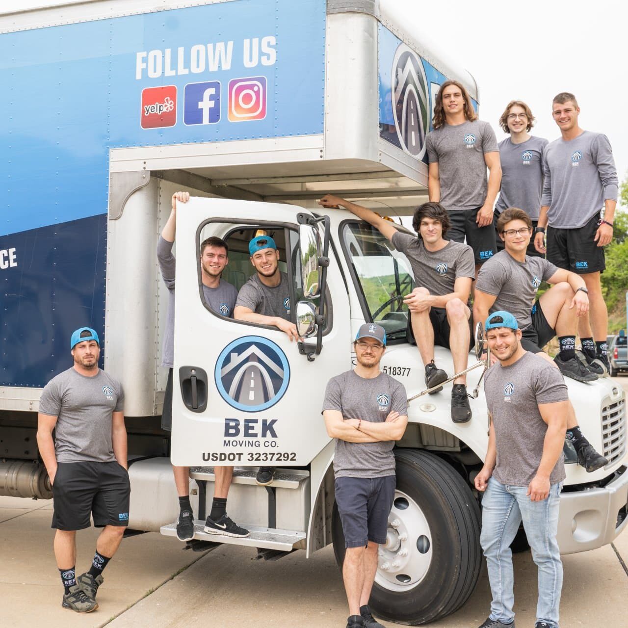 BEK-moving-co-full-crew-group-photo-with-truck BEK Moving Company team with trucks.