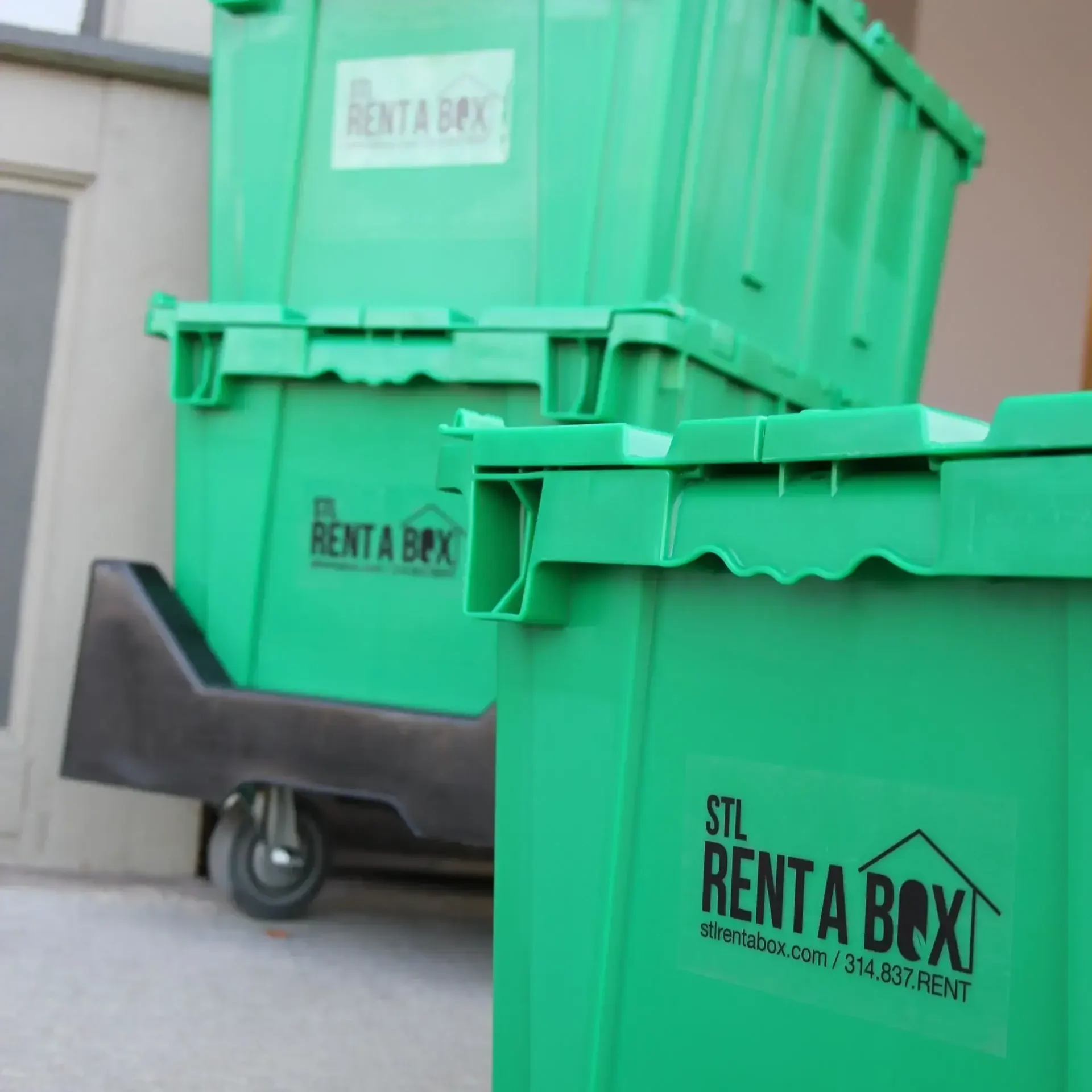 closeup rentabox containers on dolly near doorway